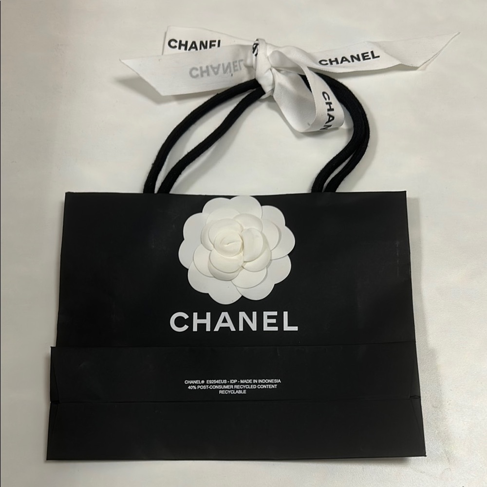 Small Black Chanel Shopping Bag with Camellia Embellishments and Logo Ribbon